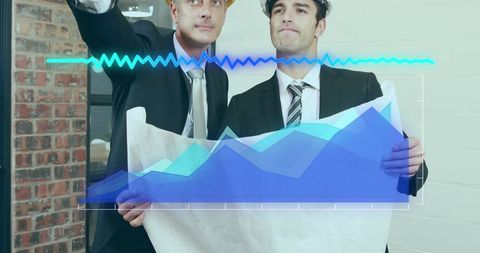 Architects analyzing plans with digital data overlay