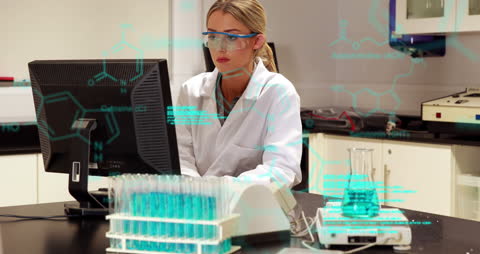 Female Scientist Using Computer in Modern Laboratory