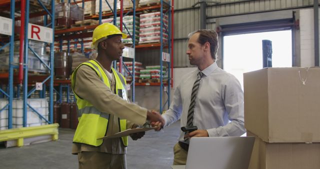 Male warehouse manager and warehouse worker in loading bay 4k - Download Free Stock Photos Pikwizard.com