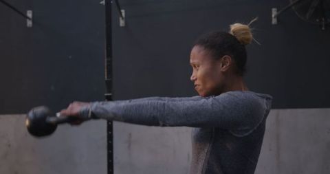 Athletic Woman Kettlebell Training for Strength and Endurance