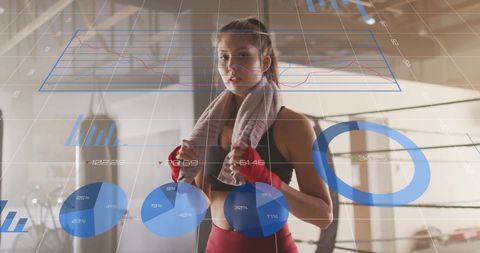 Woman in Gym Analyzing Fitness Data Visualization with Boxing Gear