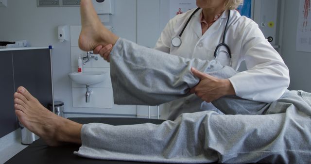 Physical Therapist Assisting Patient with Leg Exercise - Download Free Stock Images Pikwizard.com