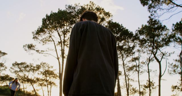 Man Walking in Forest During Sunset - Download Free Stock Images Pikwizard.com