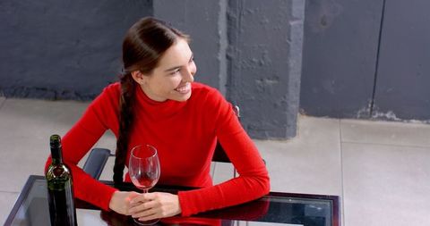 Woman Enjoying Wine at Modern Restaurant Scene