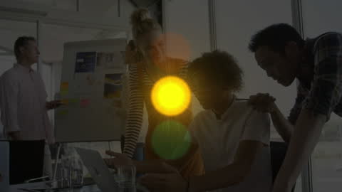 Glowing Traffic Lights Over Business Team During Meeting