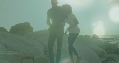 Businessmen Shaking Hands Over Abstract Cityscape with Cloud Overlay