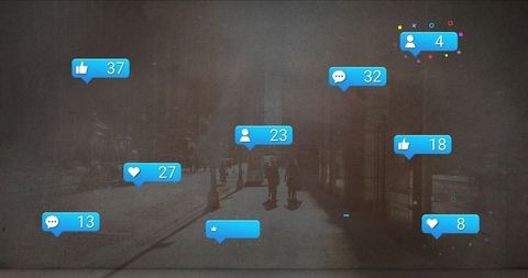 Silhouetted Figures with Social Media Icons in Urban Street