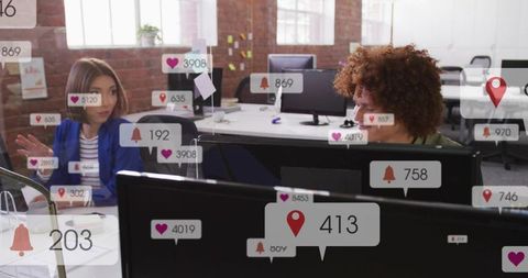 Open office coworkers collaborating with floating social media notifications and engagement
