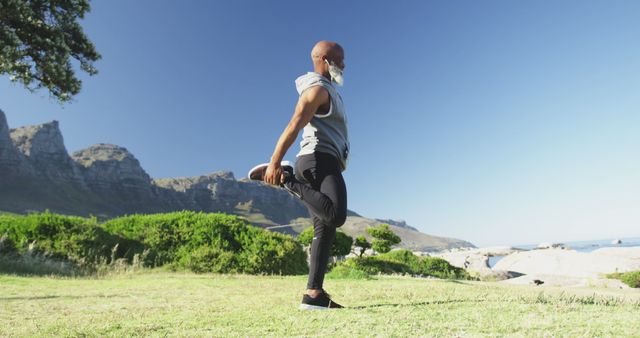 Senior Man Stretching in Peaceful Outdoor Setting - Download Free Stock Images Pikwizard.com