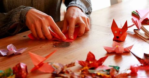 Crafting origami with colorful paper at home