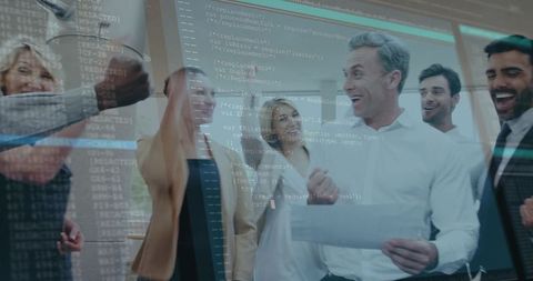 Corporate team cheering over successful tech project with transparent code overlay in modern office