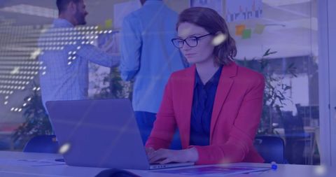 Businesswoman in Red Blazer Analyzing Data on Laptop in Office - Download Free Stock Images Pikwizard.com