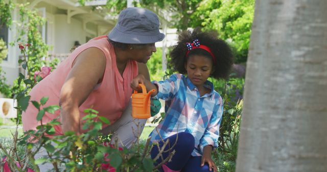 Grandmother Guiding Granddaughter in Garden Activity on Sunny Day - Download Free Stock Images Pikwizard.com