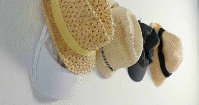 Assorted Hats Hanging on White Wall - Download Free Stock Images Pikwizard.com