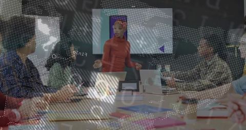 Woman presenting at conference table leading team meeting with laptops and charts