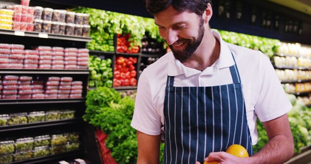 Smiling Grocery Store Worker Organizing Fresh Produce - Download Free Stock Images Pikwizard.com