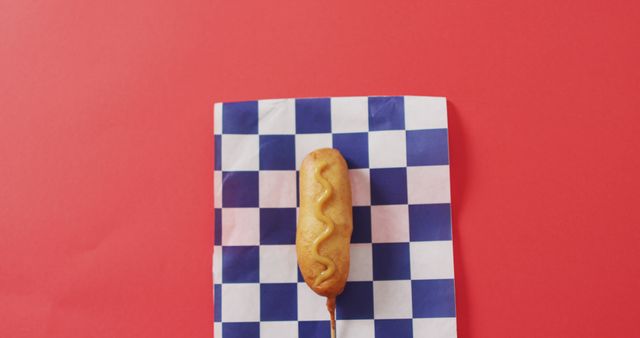 Corn Dog on Checkered Napkin with Red Background - Download Free Stock Images Pikwizard.com