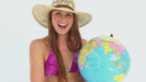 Woman Holding Globe in Fun Summer Concept
