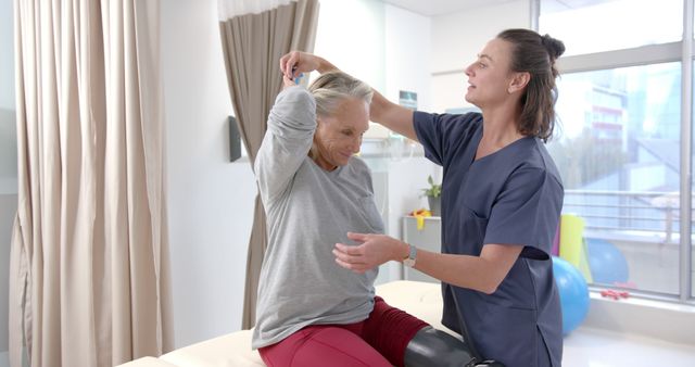 Physical Therapist Assisting Elderly Woman with Prosthetic Leg in Clinic - Download Free Stock Images Pikwizard.com