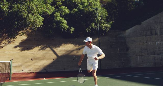 Male Tennis Player Focusing and Running on Outdoor Court - Download Free Stock Images Pikwizard.com