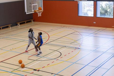 Basketball Coach and Player Training on Indoor Gym Court