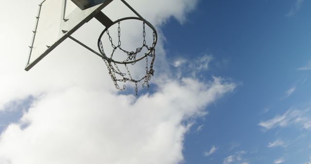 Outdoor Basketball Hoop Against Blue Sky and White Clouds - Download Free Stock Images Pikwizard.com