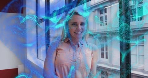 Smiling Woman in Office with Futuristic Tech Overlay