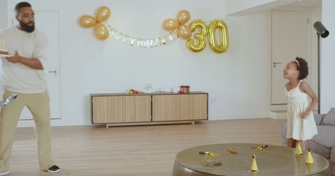 Father and Daughter Preparing Surprise Birthday at Home