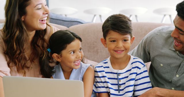 Happy Family Using Laptop on Couch at Home - Download Free Stock Images Pikwizard.com