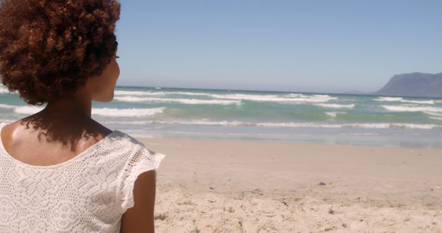 Woman with Curly Hair Enjoying Beach View - Download Free Stock Images Pikwizard.com