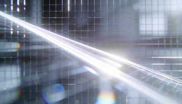 Diagonal light beam crossing glass tile grid featuring prismatic flares and reflective geometry