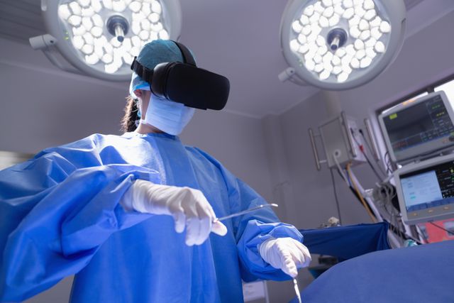 Female surgeon using virtual reality headset for surgical training in an operation room. Ideal for illustrating advancements in medical technology, healthcare innovation, and modern surgical practices. Useful for medical education materials, healthcare technology promotions, and articles on the future of surgery.