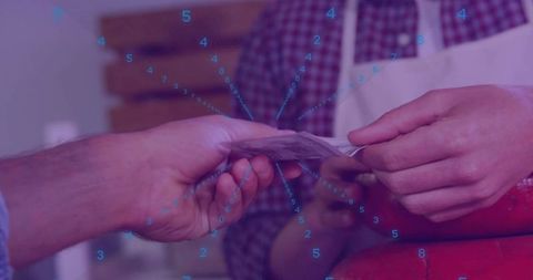 Handing cash over retail counter with digital numbers overlay, cash transaction concept