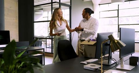 Enthusiastic Colleagues Engaging in Energetic Workplace Discussion