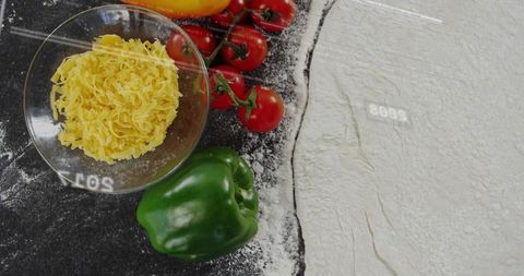 Fresh Ingredient Preparation with Vegetables and Cheese on Flour-Covered Surface