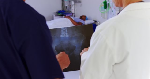 Doctors Examining X-Ray of Patient in Hospital Room - Download Free Stock Images Pikwizard.com