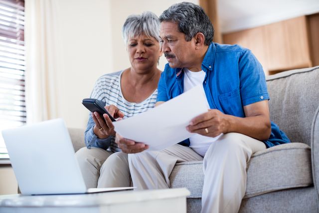 Senior Couple Reviewing Bills at Home - Download Free Stock Photos Pikwizard.com