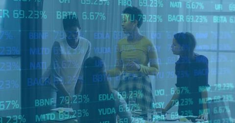 Diverse Team of Professional Women Analyzing Market Data in Modern Office