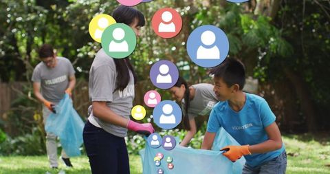 Asian family volunteering in nature cleanup activity