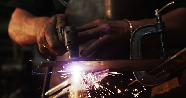 Man Grinding Metal with Sparks Flying in Workshop - Download Free Stock Images Pikwizard.com