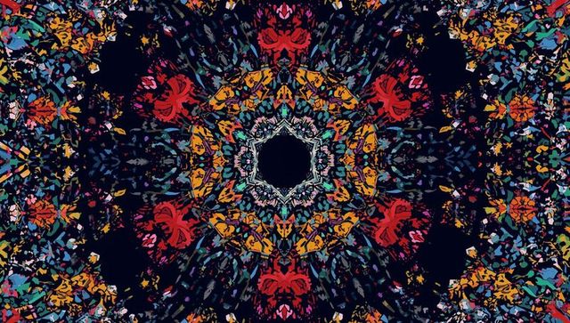 Radiating Mandala Pattern Unfolding in Vibrant Kaleidoscopic Rings and Hexagonal Void