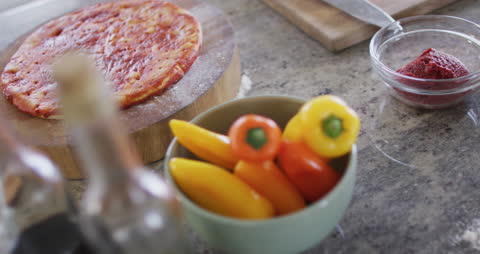 Homemade Pizza Preparation with Fresh Vegetables