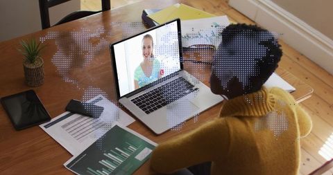 African American Woman Communicating Globally on Laptop