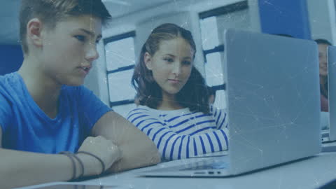 Students Engaged in Learning with Laptops in Classroom