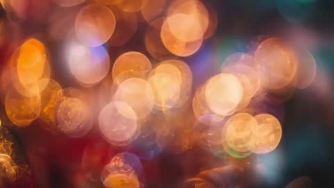 Shimmering Bokeh Lights Pulsing in Amber and Blue Abstract Orb Motion Background Loop