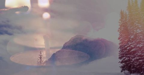 Dreamy double exposure blending snowy alpine peak with warm candlelight glow at dusk