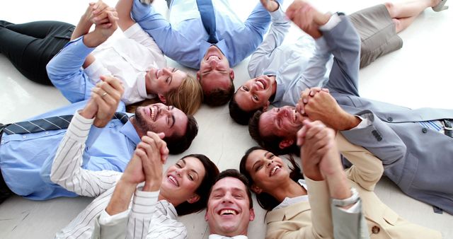 Team Members Lying In Circle Holding Hands Smiling - Download Free Stock Images Pikwizard.com