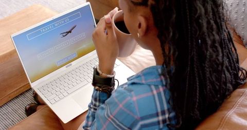 Young Woman Booking Travel Online with Coffee - Download Free Stock Images Pikwizard.com