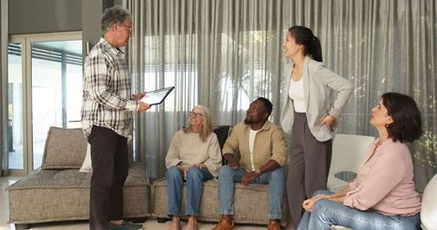 Group therapy session with happy participants and therapist interaction