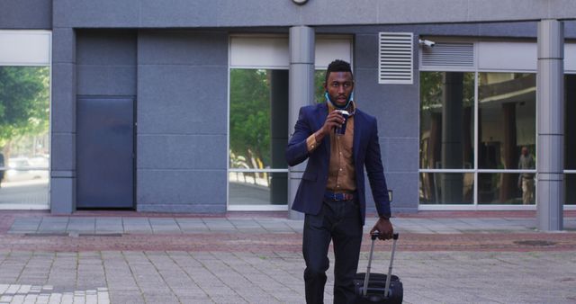 Businessman with Suitcase Taking Coffee Break Outside Office Building - Download Free Stock Images Pikwizard.com